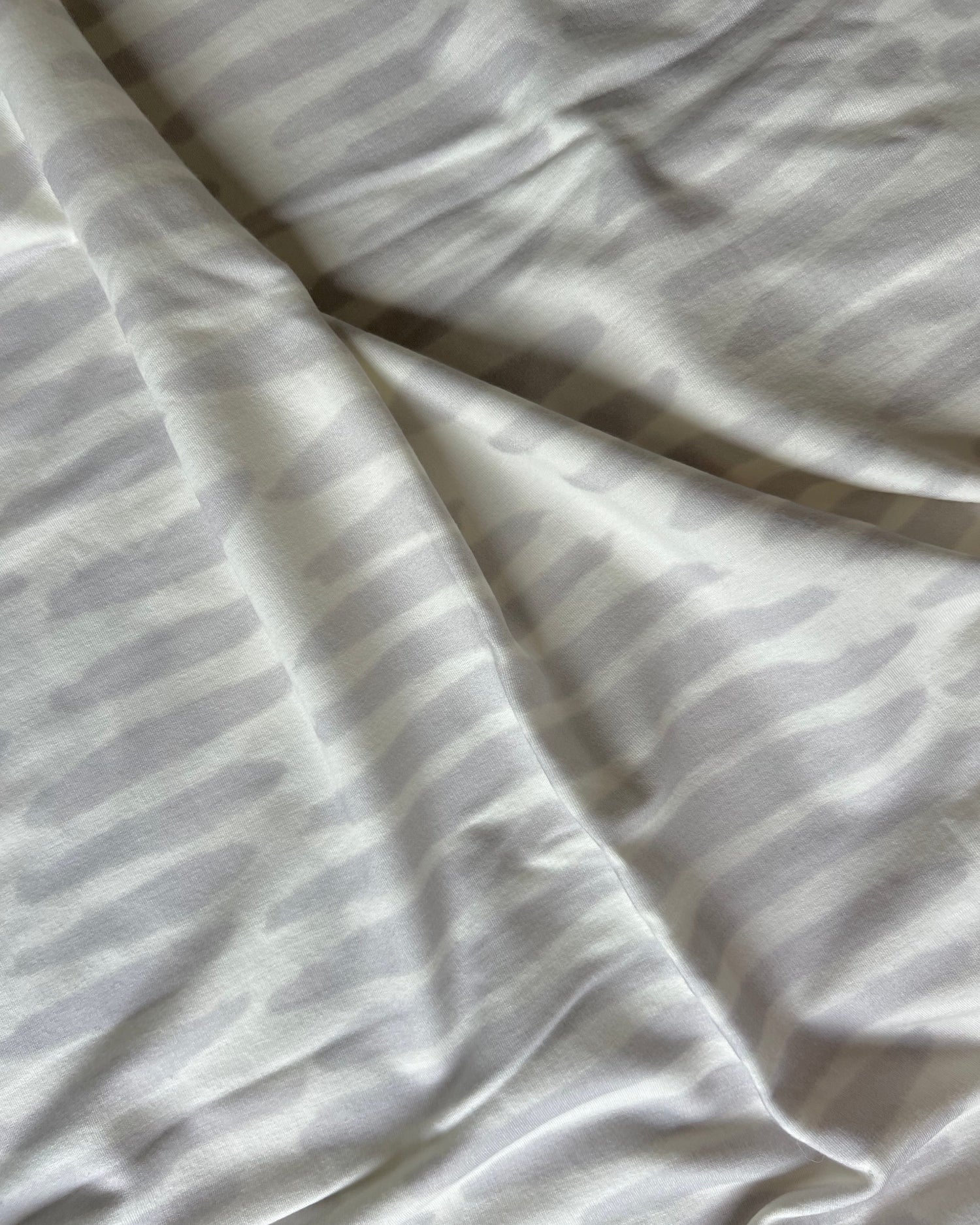 White and light gray owl print wrap close-up