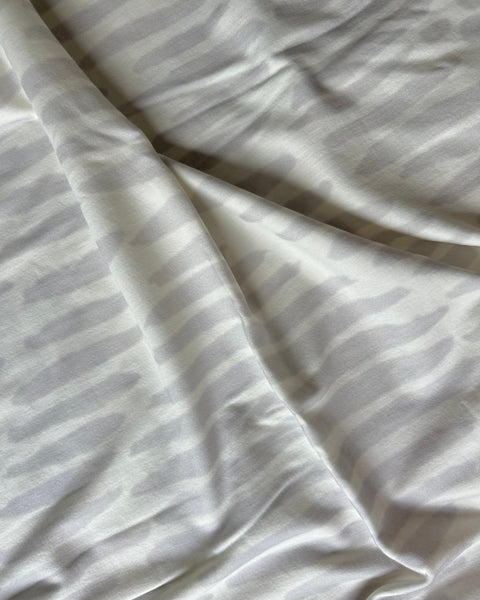 White and light gray owl print wrap close-up