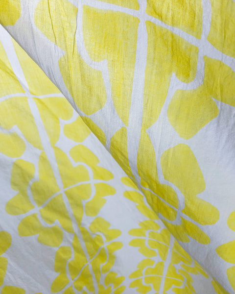 Close-up of lemon yellow and white hand block-printed sarong / grand scarf