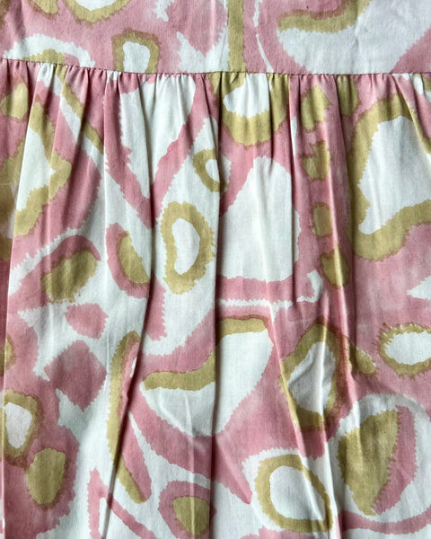 Block printed blush pink and khaki animal print wrap skirt close-up