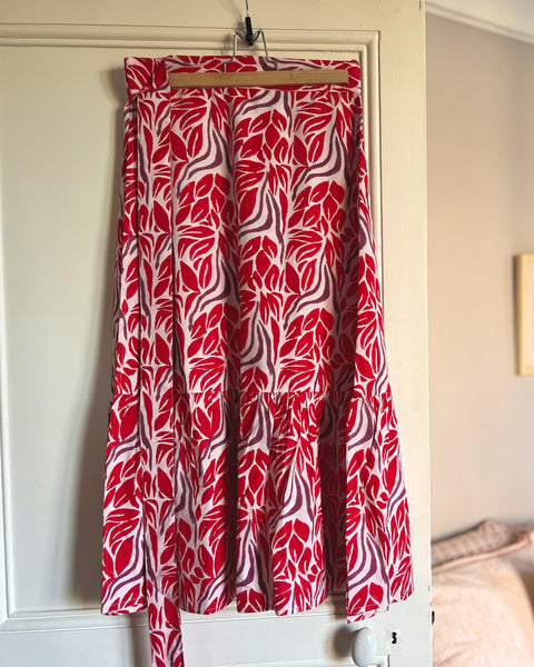Beautiful red and purple block-printed wrap skirt on hanger