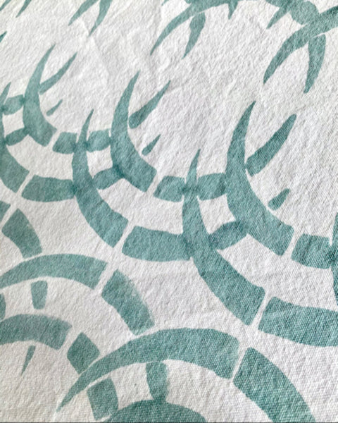 Close-up of sage blue and ice blue rhino print table runner 