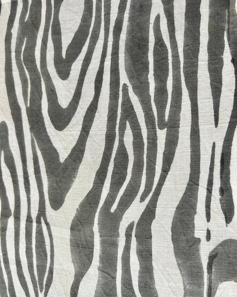 Close-up of a gray and white faux bois hand block-printed organic cotton linen table runner 